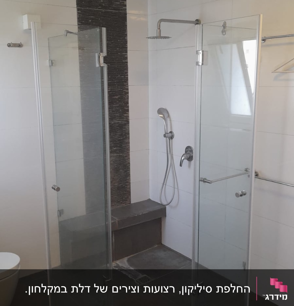 shower area with glass doors and showerhead